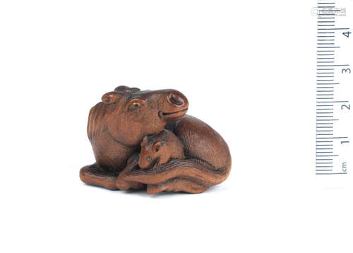 By Sari, Iwashiro Province, 19th century A wood netsuke of a horse and rat