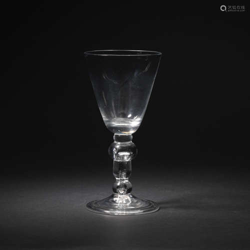 A baluster wine glass with an acorn knop, circa 1725