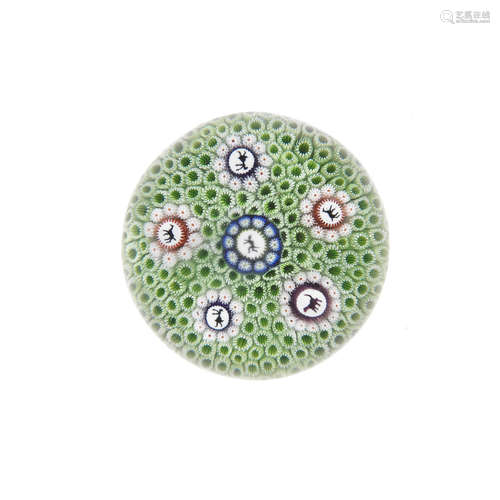 A St. Louis green carpet-ground concentric millefiori paperweight, circa 1850