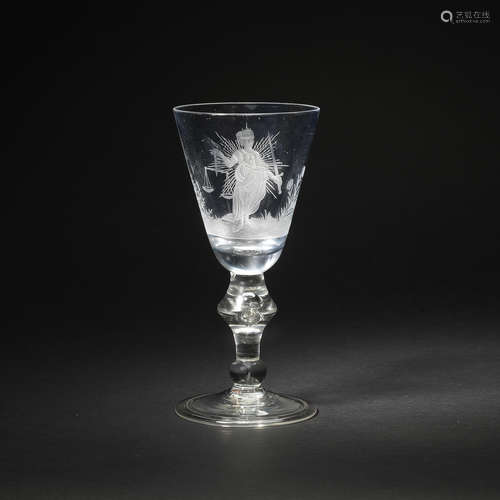 An engraved baluster Justice wine glass, circa 1720-30