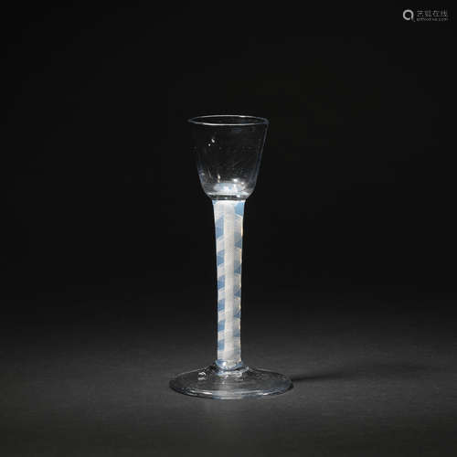 An unusual opaque-twist cordial glass with an opalescent stem, circa 1765