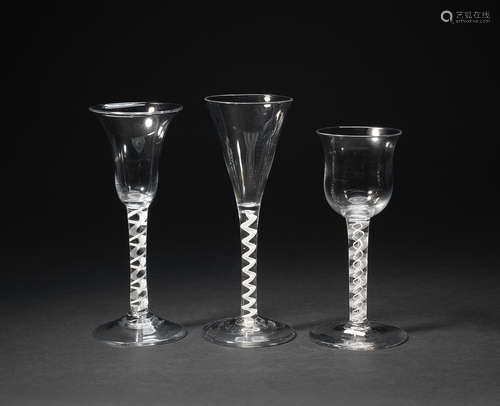 Two mixed-twist stem wine glasses and an opaque-twist flute, circa 1760