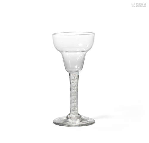 An interesting opaque twist wine glass with a soot core, circa 1760