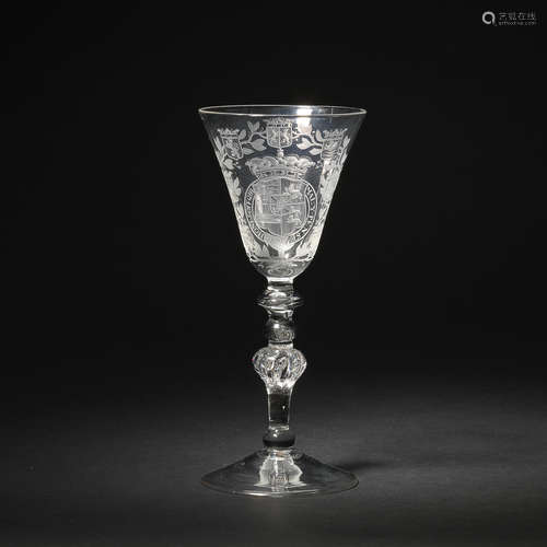 A Dutch engraved light baluster wine goblet attributed to Jacob Sang, circa 1750