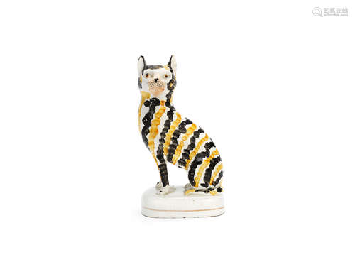 A rare Staffordshire model of a cat, mid 19th century