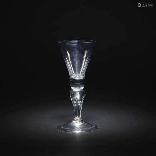 A rare moulded stem baluster wine glass, circa 1715