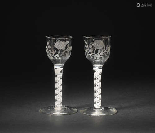 A pair of engraved opaque-twist wine glasses, circa 1765