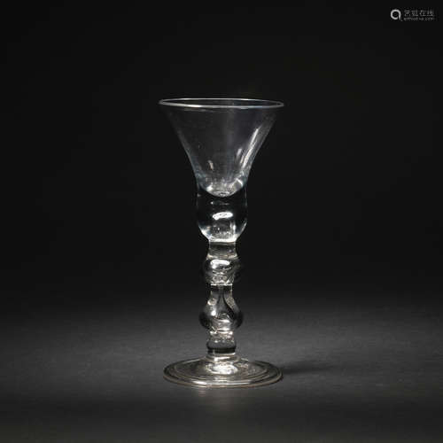 A double drop-knop baluster wine glass, circa 1720