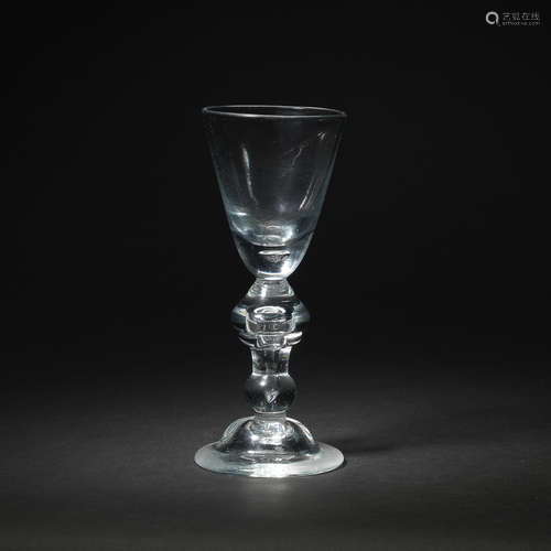 A heavy baluster wine glass, circa 1720