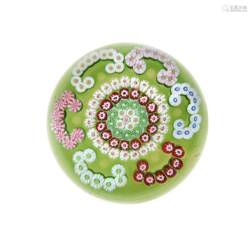 A Clichy green-ground patterned millefiori paperweight, circa 1850