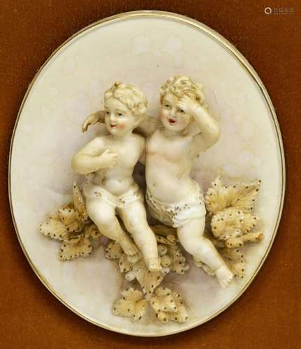 (2) OVAL FRAMED BISQUE PORCELAIN PUTTI PLAQUES