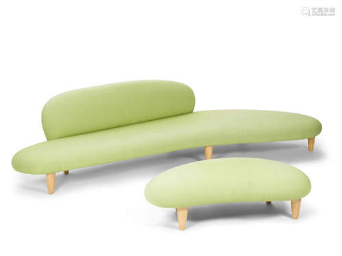 Free-form Sofa and Ottomandesigned circa 1950, executed circa 2002for Vitra, maple, upholstery, polyurethane foam, each with Vitra labels and tagsheight of sofa 26 1/2in (67cm); width 118in (299cm); depth 51 1/4in (130cm); height of ottoman 12 1/2in (31cm); width 48in (121cm); depth 28in (71cm)   Isamu Noguchi (1904-1988)