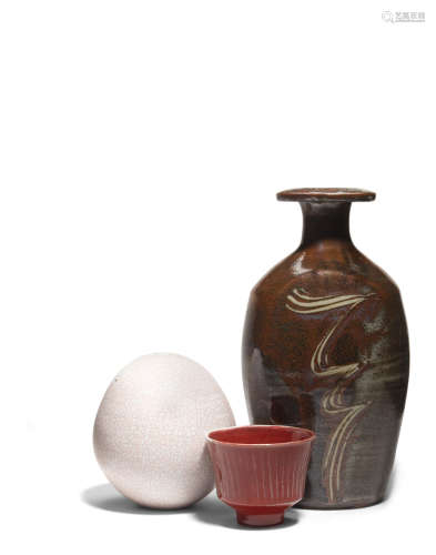 Group of Three Vesselscirca 1980glazed stoneware and porcelain; comprising a shouldered vase, ovoid vase and a fluted tea bowl, each impressed with 'DL' seal, the largest also impressed 'TL'heights 3 1/8in (8cm); 5 3/4in (14.6cm); 11 3/4in (30cm)  David Leach (1911-2005)