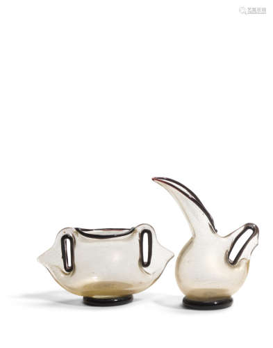 Eugenio Pitcher and Twin Handled Vasecirca 1955designed circa 1951, Barovier & Toso, blown gold glass with applied black decorationHeights 6in (15.2cm) and 3 3/4in (9.5cm)  Ercole Barovier (1889-1974)
