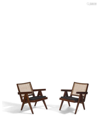 Pair of Easy Armchairscirca 1955teak, cane, upholsteryheight 28 1/4in (72cm); width 19in (49cm), depth 20in (51cm)  Pierre Jeanneret (1896-1967)