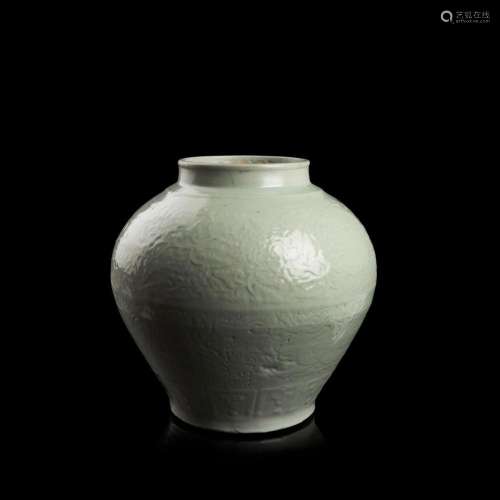 RARE WHITE-GLAZED AND CARVED 'DRAGON' JAR INSCRIBED RUN YUAN, LATE YUAN/EARLY MING DYNASTY 35.5cm wide