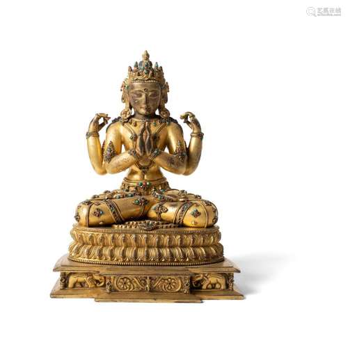 GILT-BRONZE FIGURE OF A FOUR-ARMED DEITY 28.5cm high