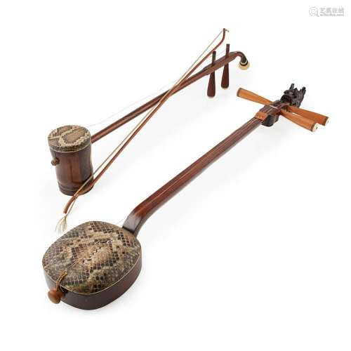 TWO HARDWOOD AND SNAKESKIN MOUNTED MUSICAL INSTRUMENTS 20TH CENTURY 92cm high