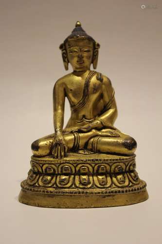 A GILT-BRONZE FIGURE OF SHAKYAMUNI