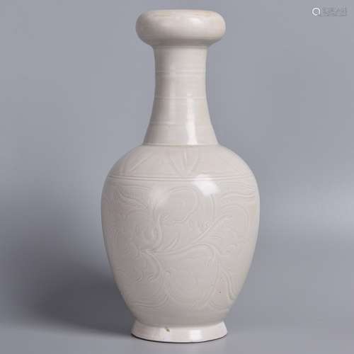 A WHITE GLAZED CARVED VASE