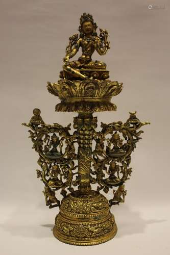 A GILT-BRONZE FIGRUE OF TARA  AND STAND