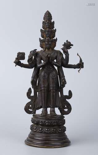 A BRONZE FIGURE OF AN ELEVEN-HEADED AVALOKITESHVAR