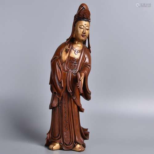 A HUANGYANG WOOD FIGURE OF STANDING GUANYIN