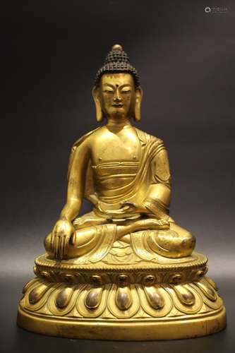 A GILT-BRONZE FIGURE OF SHAKYAMUNI