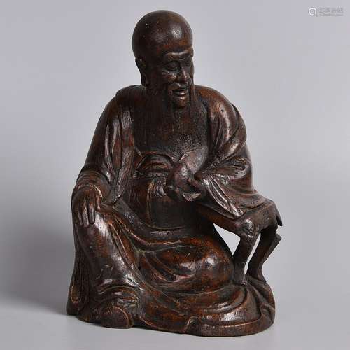 A WOODEN FIGURE OF LIFE GOD