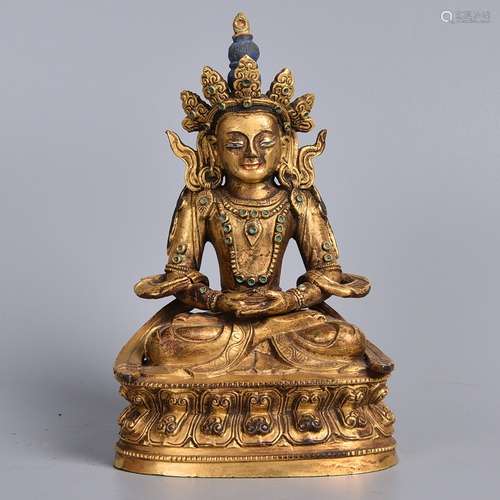 A GIL-BRONZE FIGURE OF MANJUSHRI