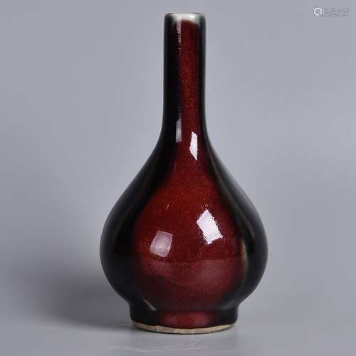 A RED GLAZED BOTTLE VASE