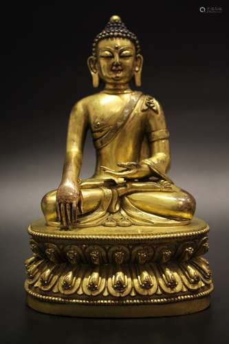 A GILT-BRONZE FIGURE OF SHAKYAMUNI