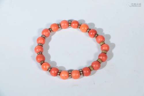 A CORAL BEAD BRACELET