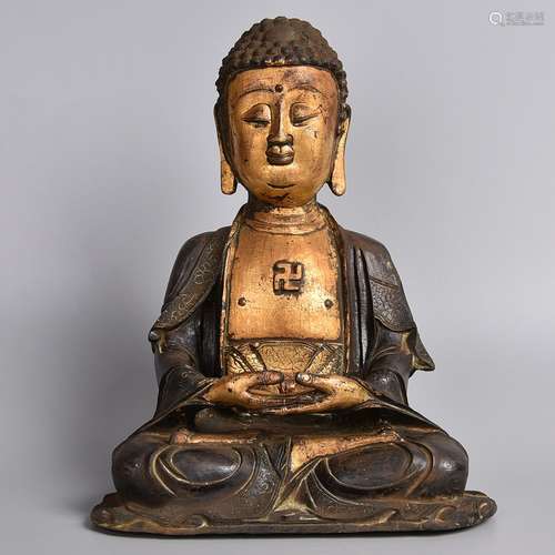 A GILT-BRONZE FIGURE OF SHAKYAMUNI