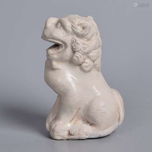 A WHITE GLAZED OF LION