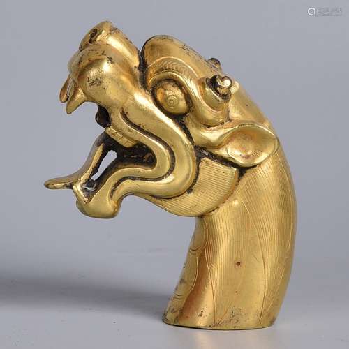 A GILT-BRONZE DRAGON HEAD