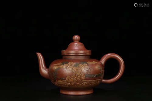 A CLAY TEAPOT WITH MUD PAINTING