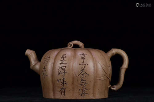 A DUAN MUD TEAPOT WITH POEM CARVING ON BODY