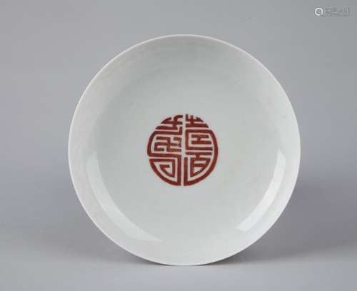 AN IRON-RED 'LONGEVITY' DISH, YONGZHENG MARK, QING DYNASTY