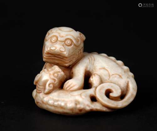 A 'CHICKEN BONE' JADE LIONS GROUP, MING DYNASTY