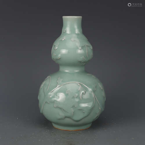 A MOLDED LONGQUAN CELADON 'PEONY' VASE, 13TH CENTURY