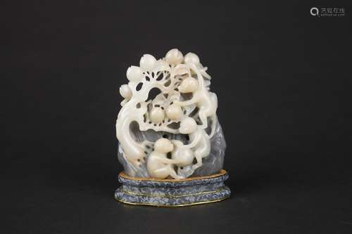 A JADE FIGURE OF A MONKEY