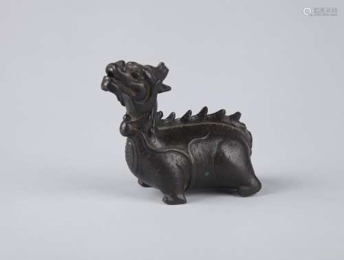 A BRONZE FIGURE OF A MYTHICAL BEAST, EARLY MING DYNASTY