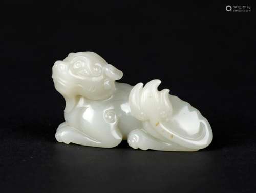 A CELADON JADE FIGURE OF A MYTHICAL BEAST, QING DYNASTY