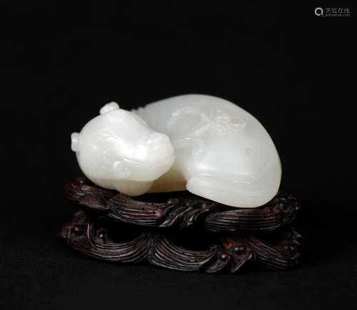 A WHITE JADE FIGURE OF A MYTHICAL BEAST, QING DYNASTY