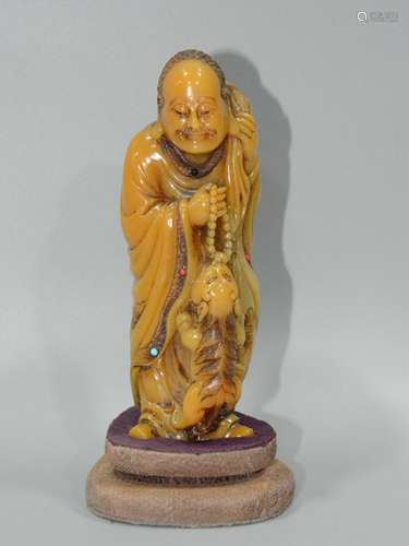 A SOAPSTONE FIGURE OF LUOHAN, QING DYNASTY