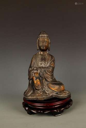 A TALL BRONZE GUAN YIN FIGURE