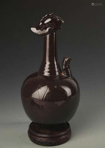 A DING KILN LOTUS FLOWER PATTERN PHOENIX HEAD EWER