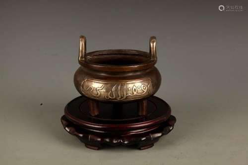 A DOUBLE EAR TRIPOD FOOT BRONZE CENSER