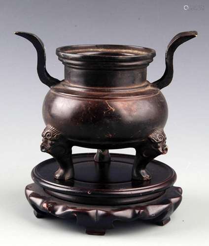 A TALL TWO HANDLE BRONZE CENSER